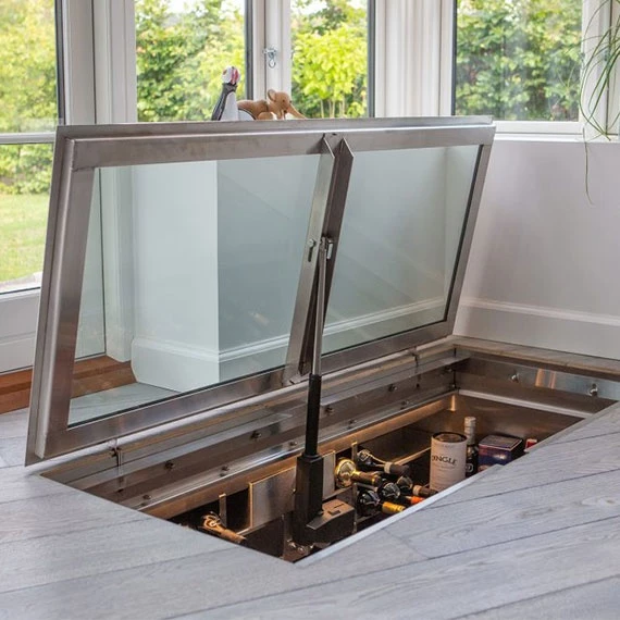 Vinorage wine cellar in floor with glass door 